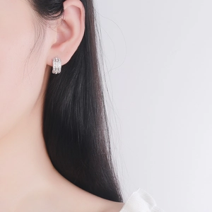 Elegant S925 sterling silver huggie earrings featuring three rows of shimmering crystals