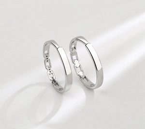 Close-up of interlocking S925 sterling silver rings with geometric chain link details