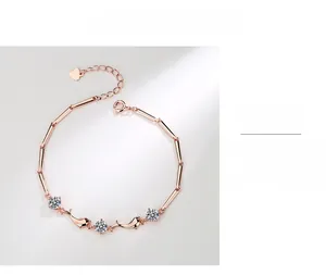 Detailed close-up of rose gold S925 silver dolphin bracelet with zircon stones and heart tag