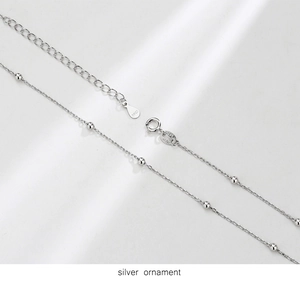 Close-up of S925 sterling silver choker chain with delicate beads and lobster clasp