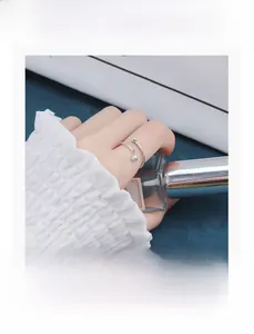 Minimalist S925 sterling silver open ring with double beads on a model's hand