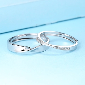 Adjustable S925 sterling silver Mobius couple rings with polished finish and cubic zirconia