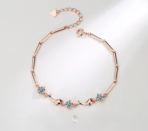 Detail of rose gold dolphin bracelet with sparkling round crystals and bamboo chain links