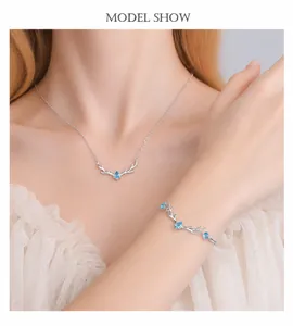 S925 silver elk antler necklace and bracelet set with blue teardrop zircon on a model