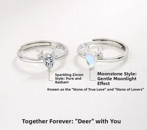 Detail of antler silver rings with drop-shaped zircon and moonstone inlay for couples