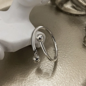 S925 sterling silver open ring with polished metal beads and a swinging pendant