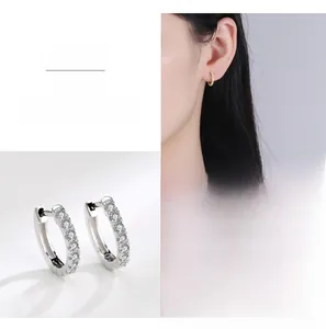 Close-up of S925 silver hoop earrings with pave cubic zirconia and model view