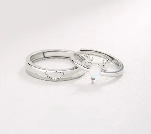 Detailed view of S925 silver antler couple rings with white teardrop gemstone