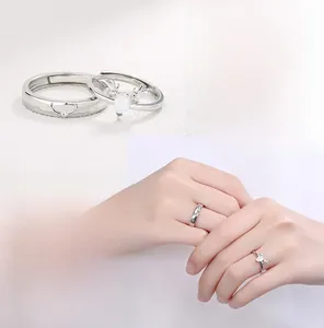 Detail of S925 silver reindeer antler couple rings with moonstone and heart-matching design