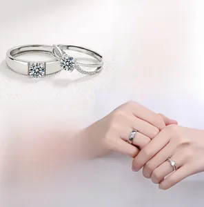 Macro detail and hand model view of S925 silver couple rings with sparkling diamonds