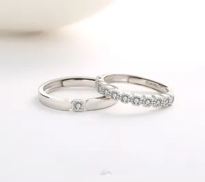 Detailed view of S925 silver couple rings featuring pave zircon and square diamond accents