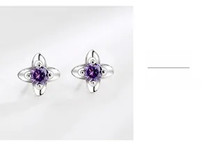 Detailed close-up of S925 silver four-leaf clover earrings with purple zircon crystals