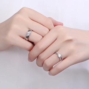 Elegant S925 silver couple rings with sparkling diamonds on interlocking hands