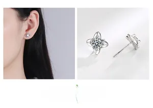 Close-up of S999 silver four-leaf clover stud earrings with sparkling round zirconia