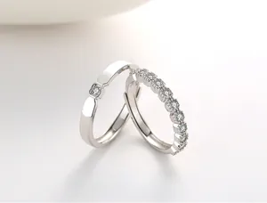 Macro shot of S925 sterling silver couple rings with sparkling pavé cubic zirconia diamonds