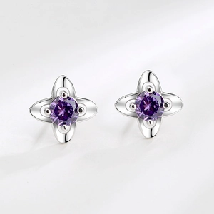 Elegant S999 sterling silver four-leaf clover stud earrings with purple crystals