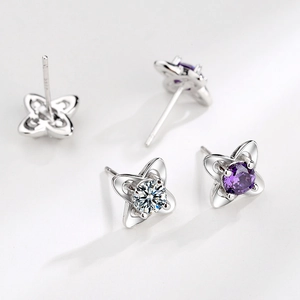 S999 silver four-leaf clover stud earrings with white and purple cubic zirconia stones