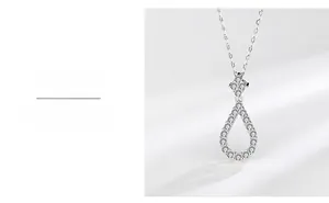 Detail of S925 silver water drop pendant with sparkling cubic zirconia on fine link chain
