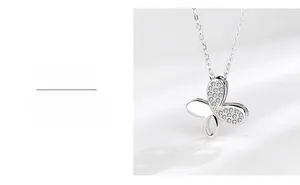 Detail of silver S925 butterfly pendant showing shimmering crystals and anti-oxidize plating