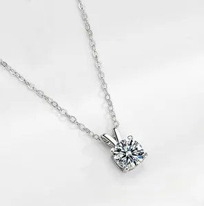 Macro shot of silver S925 necklace showing the four-prong moissanite setting details