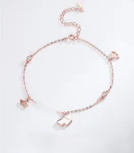 Detail of rose gold S925 sterling silver anklet with ginkgo leaf and zircon accents