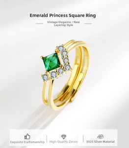 Detail of S925 sterling silver ring with emerald-green stone and zircon accents