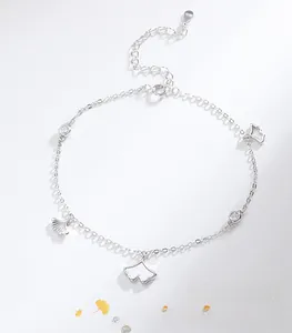 Detailed macro view of S925 sterling silver ginkgo leaf anklet with mother of pearl inlay
