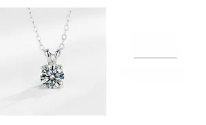 Macro detail of silver O-chain and round moissanite pendant in four-prong setting