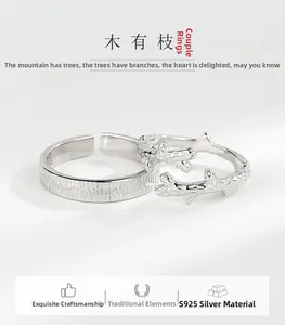 Detailed view of S925 silver couple rings featuring bark texture and branch design