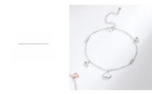 Detailed macro view of S925 sterling silver ginkgo leaf charms with white enamel inlay