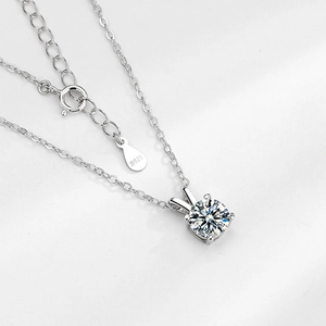 Elegant S925 sterling silver necklace with a four-prong round brilliant moissanite pendant