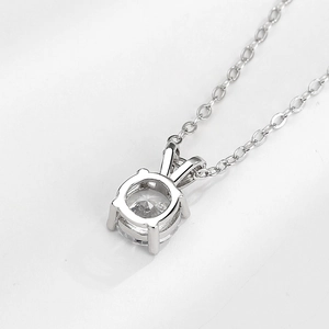 Minimalist S925 sterling silver necklace with a four-prong round moissanite pendant