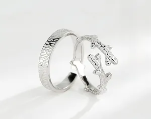 Macro detail of S925 silver couple rings showing wood grain texture and branch design