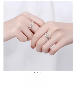 Detail of S925 silver couple rings featuring natural bark texture and branch design