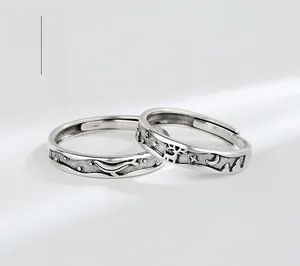 Detailed relief of whale and deer on vintage S925 sterling silver couple rings
