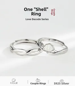 Close-up of S925 sterling silver couple rings with mother-of-pearl and adjustable bands