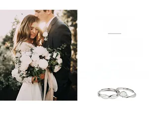 Detail view of silver couple rings with shell inlay and wave twisted band design