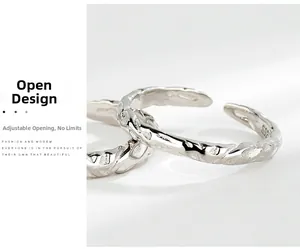 Detailed macro view of S925 sterling silver ring featuring irregular hammered texture