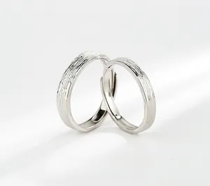 Close-up of S925 sterling silver couple rings set with adjustable tree texture design