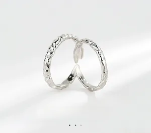 Detailed macro shot of S925 sterling silver rings with irregular hammered textures