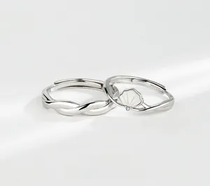 Macro shot of S925 silver couples ring set featuring white mother of pearl shell and diamond