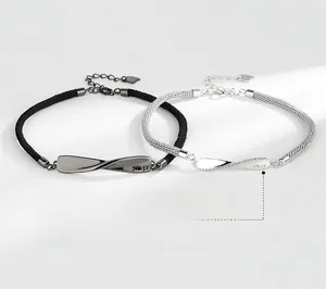 Detail of Mobius couple bracelets with No.52 engraving and sparkling zircon inlay