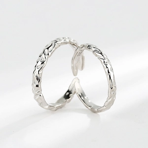 Minimalist S925 sterling silver open rings with irregular hammered texture on white background