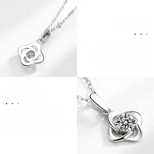 Macro detail of S925 sterling silver four-leaf clover necklace with Moissanite stone