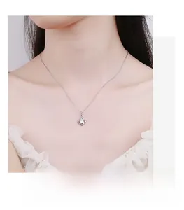 Close-up of S925 silver clover necklace with moissanite on model for a minimalist look