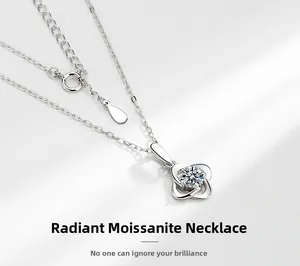 Macro detail of S925 silver clover necklace featuring a brilliant moissanite stone