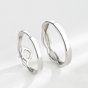 Polished silver minimalist couple ring with unique hollow flower interior design detail