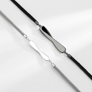Minimalist Mobius loop couple bracelets with braided cord and polished silver metal accents