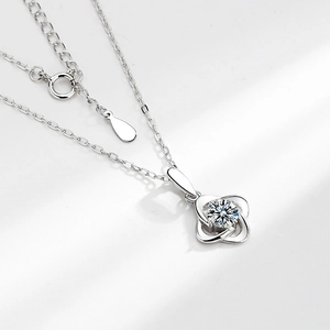 Elegant S925 sterling silver four-leaf clover necklace with a sparkling moissanite diamond