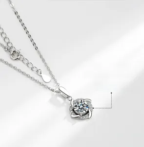Macro shot of S925 sterling silver windmill pendant with moissanite center stone
